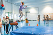 © unai - Young girl performing gymnastics vaulting in school gym class