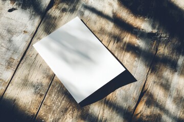 Aufkleber - Blank paper resting on rustic wooden table illuminated by soft natural light