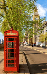 Wall Mural - Red telephone box on Victoria embankment with Big Ben at background, London, UK