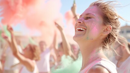 Woman celebrating at a colorful Holi festival with vibrant powder and smiling in a cheerful outdoor setting filled with energy and happiness