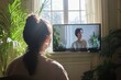 © AHNH2 - Woman Watching TV with Plants Surrounding in Sunlit Room