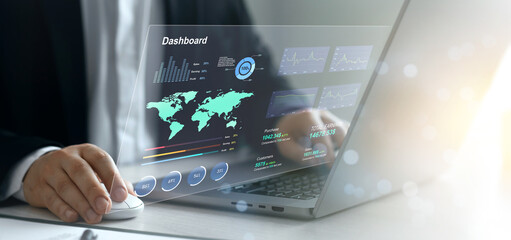 Wall Mural - Businessman using KPI dashboard.Financial business data analytics graph dashboard. Management data System KPI connected in database for follow earnings,operations and sales data.	