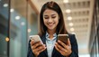 © shagun - young businesswoman texting on mobile phone