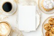 © Odrua Design - Xícara de café elegante com detalhes dourados, acompanhada de doces e decorações festivas em fundo branco, criada com IA generativa para um visual sofisticado e convidativo
