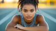 © crazyass - Confident athletic woman ready to race at the starting line outdoor track portrait empowerment close-up
