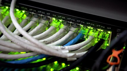Wall Mural - network server room server rack with fiber optic cables attached to front panel switch ports