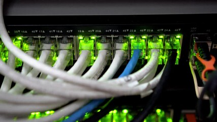 Wall Mural - close up view of internet ethernet cable on network switches background in server room data center
