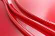 Smooth, glossy red curves creating an abstract design with a vibrant background for artistic use