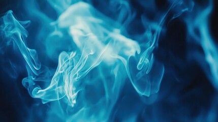 Wall Mural - Abstract blue smoke swirling in a dark background, creating a mystical atmosphere.