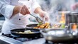 © Phonphysith - A professional chef cooking a multi-course meal for a fine dining event, focusing on every stage of preparation.