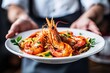 © Tatyana - Delicious seafood pasta garnished with herbs served on plate