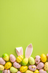 Wall Mural - colorful vertical painted easter eggs and playful bunny ears on a vibrant green background creating 