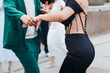 © tsuguliev - High school graduates dancing on prom, waltz and classical ball slow dance in dresses and suits on school graduation party, boys and girls ballroom dancers, couples dance quadrille and polonaise