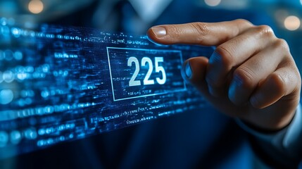 Close-up of a hand interacting with a digital interface showing the number 225 within a code stream.