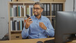 © Krakenimages.com - Man talking on phone in office setting with bookshelf background
