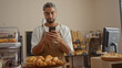 © Krakenimages.com - Young man with beard using smartphone in bakery shop interior surrounded by pastries and bread loaves on shelves
