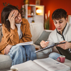 Wall Mural - man help and support woman colleague while she study at home