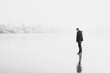 © T.Den_Team - Silhouette of alone man standing on winter fog and ice background. Concept of psychology, guy thinking about something