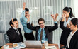 © InfiniteFlow - Group of happy businesspeople in celebratory gesture and successful efficient teamwork. Diverse race office worker celebrate after made progress on marketing planning in corporate office. Meticulous