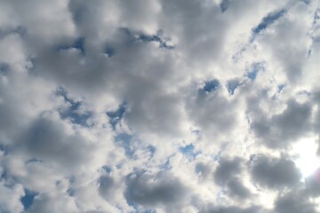 Wall Mural - stratocumulus clouds covered blue sky, natural cloudscape