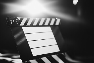 Aufkleber - Movie clapperboard ready for filming with bright lights in the background during a production setup. Generative AI