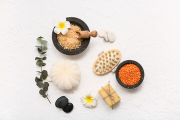 Wall Mural - Composition with bowls of sea salt, bath sponge, spa stones, soap bars and flowers on white background