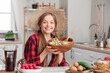 © Pixel-Shot - Young woman in straw hat with tasty okroshka at home