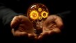 © Yuliia - Glowing lightbulb with golden mechanical gears inside held in open palms against dark background, symbolizing innovation and creative business solutions.