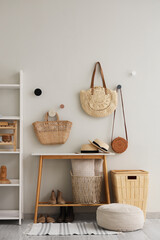 Wall Mural - Interior of hall with coffee table, pouf and wicker bags