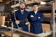 © JackF - Portrait of two carpenters in uniform in the interior of a furniture factory