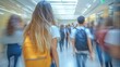 © Justlight - Motion blur captures high school students walking through a bustling hallway during break time, embodying the vibrant energy of back to school life and youthful camaraderie