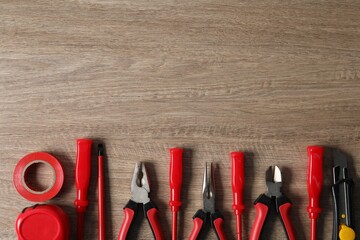 Wall Mural - Different electrical tools on wooden table, flat lay. Space for text