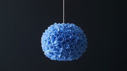 Canvas Print - Blue paper flower ball hanging, dark background, decoration