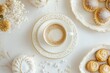 © Odrua Design - Xícara de café elegante com detalhes dourados, acompanhada de doces e decorações festivas em fundo branco, criada com IA generativa para um visual sofisticado e convidativo