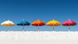 © tugkiara - Colorful beach umbrellas on a white sandy shore against a clear blue sky. Ideal for travel brochures or vacation advertising