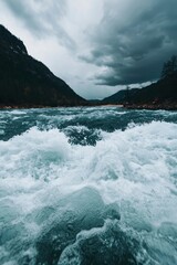 Wall Mural - Raging river flows down the mountain, under a stormy sky. Nature stock photo