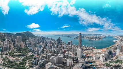 Poster - A stunning 4k still video frame offers a zoomed-in aerial view of Hong Kong's cityscape, showcasing its vibrant skyline and surrounding waters under a bright blue sky.
