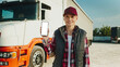 © VAKSMANV - Truck driver using mobile phone. Smartphone mockup