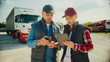 © VAKSMANV - Front camera view of cute Caucasian couple working together in delivery company. Deciding on route to destination. Looking at map on tablet device. Talking while making decision. Modern technology.