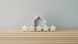 © E - Five stars and a wooden house on a gray background. The concept of the best housing, luxury apartments VIP class. The best service and universal recognition, a high evaluation. Success. Feedback