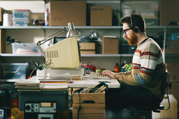 Vintage style tech guy working with a computer