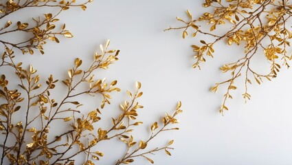 Wall Mural - Golden decorative branches on light background with space for text. Elegant floral arrangement for design or decoration purposes. Copy Space