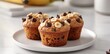 © wpw - Banana Chocolate Chip Muffins on White Plate