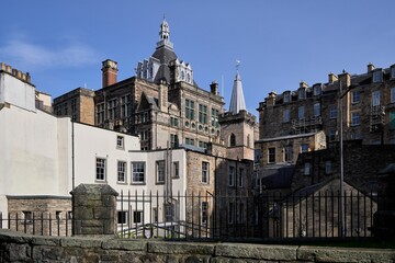 Wall Mural - Historic Edinburgh architecture under blue sky.