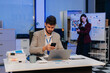 © NINENII - Business man Analyzing Data with Laptops and Graphs in Office.