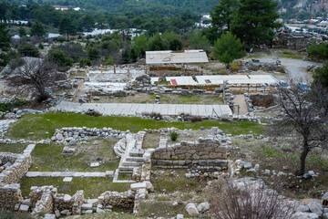 Wall Mural - Remains of gymnasium in acnient Lycian city Arycanda. Ancient city on mountain near Aykiricay village.Well preserved semi-circular theater of Arycanda, ancient Lycian city in Antalya, Turkey.
