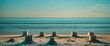 © Cyber Shutter - Sandcastles on a beach with soft waves in the background and clear sky during sunset Copy Space