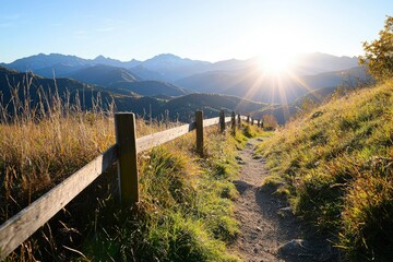 Wall Mural - Path leads to mountains at sunset, for hiking, nature-inspired websites