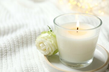 Wall Mural - Beautiful candle on white fabric