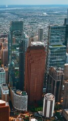 Wall Mural - Top view on Philadelphia group of skyscrapers at daytime. Vast cityscape limited by the rivers at backdrop. Vertical video